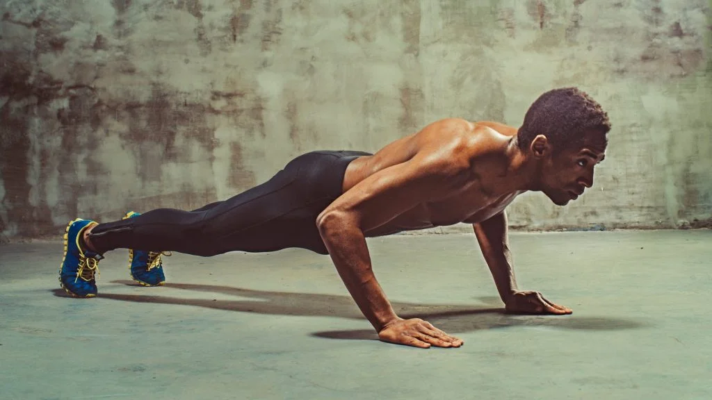 oYDbf5hQAePHEBNZTQMXRA 1 Full body shot of shirtless man doing push ups