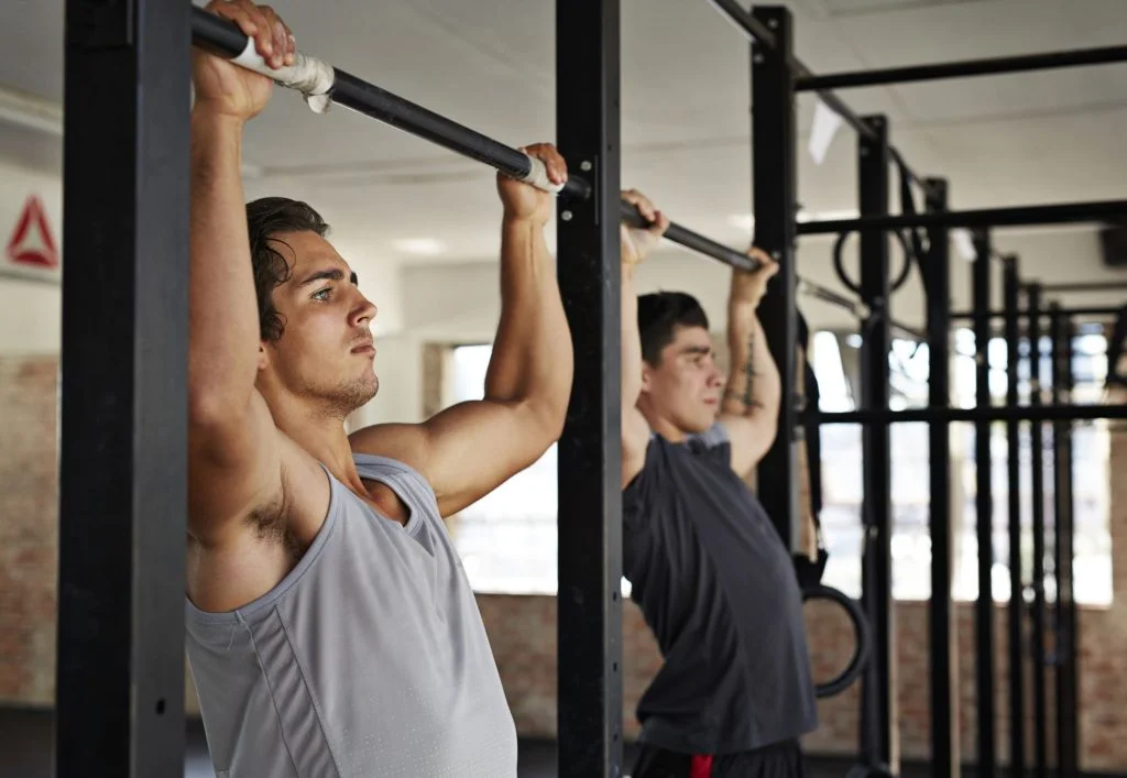 men doing pull ups at gym gym royalty free image 1583362313