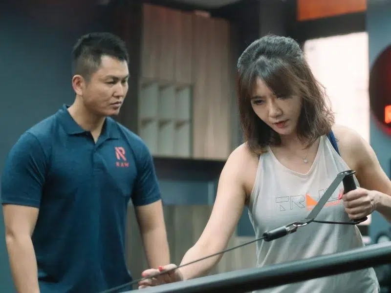 RAW Active personal trainer Singapore coaching functional training session in Orchard