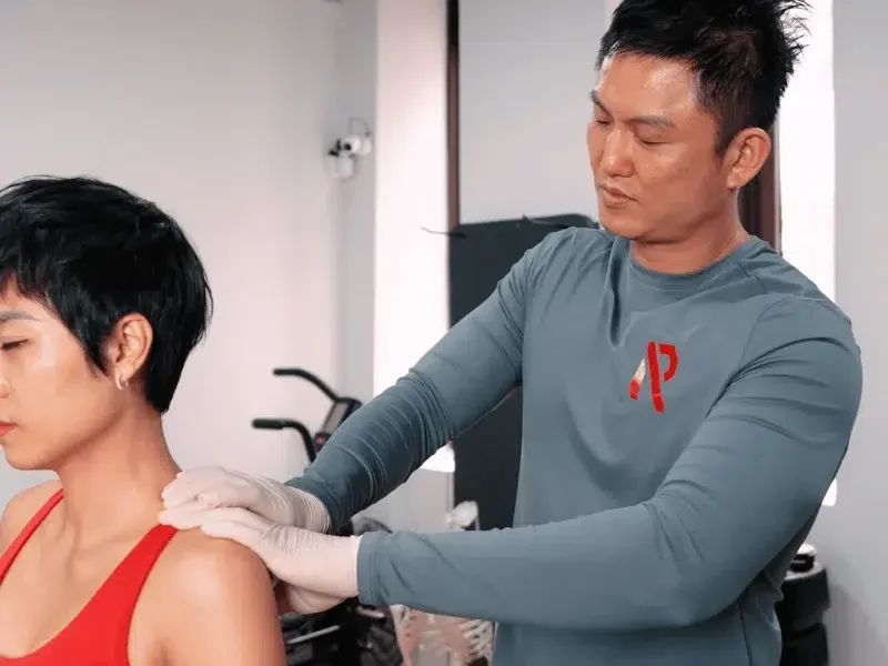 RAW Active personal trainer Singapore performing sports massage and muscle recovery at private gym RAW Active personal trainer Singapore performing sports massage and muscle recovery at private gym